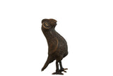 Vintage African copper bird sculpture with a dark patina and detailed textured surface, 8 inches tall.