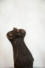 Vintage African copper bird head showing sculpted details and aged texture.