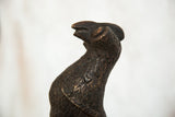 Textured dark copper finish on the vintage African bird sculpture.
