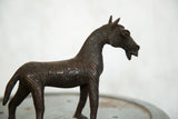 Detailed head and neck of the vintage African copper zebra sculpture with etched stripes.