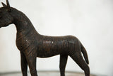 Vintage copper zebra sculpture body with etched stripe details and aged metallic finish.