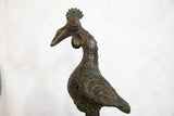 Detailed vintage African copper rooster sculpture with textured body and green patina.
