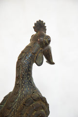 Detailed copper neck and head of a vintage African rooster with green patina.