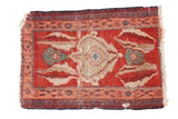 Antique Persian Serapi mat with an asymmetric shell design in cherry red, blue, and sand, circa 1890s.