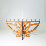 Amber bamboo Lotus Flower Menorah featuring nickel candle cups and white candles.