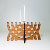Amber bamboo Arcs Menorah with intersecting geometric design and nickel candle cups.