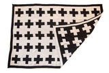 Eco-Friendly Made in USA Baby Swiss Cross Blanket, reversible black and white geometric pattern.