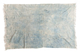 Collectible vintage hand woven African indigo throw in variegated denim blue.