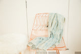 Draped hand woven denim mossi indigo African textile, showing its soft texture and fringe.