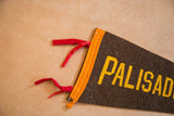Aged brown felt flag corner with yellow lettering, orange trim, white stitching, and red ties.