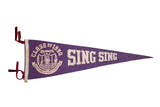 Vintage purple felt Sing Sing pennant featuring 'Class of 1990' inmate behind bars design.