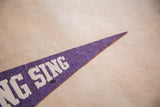 Vintage purple felt Sing Sing pennant tip, with white 'SING' lettering and texture.