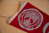 Ohio State University felt flag with detailed white school crest and beige ties.