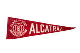 Vintage red felt Alcatraz Class of 1990 pennant with white prisoner graphic and text.