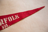 Red felt Norfolk Virginia pennant with cream 'FOLK VA' text, showing felt texture.