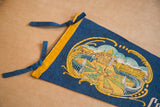 Roman Singers Felt Flag showing blue felt ties, yellow trim, and Basilica imagery.