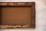 Back of antique painting, showing aged wooden stretcher frame and canvas.