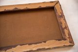 Reverse of antique landscape painting, showing aged brown canvas and peeling frame tape.