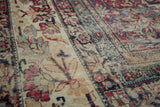 Antique Kermanshah rug, camel field with scrolling florals, showing mostly even wear to foundation.