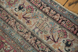 Antique Kermanshah carpet border detail with soldier, horn, lantern motif in cochineal and blue.