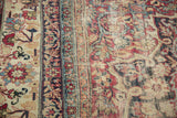 Antique Kermanshah carpet border with cochineal red, navy blue scrolling florals, and even wear to foundation.