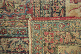 Fringed edge and worn cochineal red border of antique Kermanshah carpet.