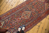 Vintage Bibikabad runner detail: Herati motif in brick red, navy blue, and ivory.