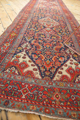 Elongated multi-medallion Herati pattern vintage runner with a navy and brick red palette.