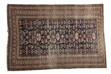 Antique Shirvan rug with geometric perepedil rams horn motifs, Kufic border, and indigo, ruby red, seafoam green.