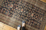 Finely woven antique Shirvan rug featuring indigo perepedil rams horn motifs and Kufic border.