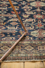Finely woven detail of the antique Shirvan rug's indigo geometric motifs and aged character.