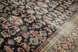 Unusually finely woven antique Shirvan with perepedil motif and Kufic border.