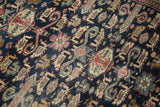 Worn knot heads and intricate perepedil design of a collectible Shirvan rug.