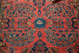 Hand knotted traditional Sarouk pattern, blue palmette, cherry red ground, floral vinery.