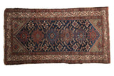 Vintage Hamadan runner with intricate geometric medallions, deep indigo and madder red palette, 3'3