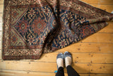 Vintage Hamadan runner with deep indigo field, Herati motif, and oxidized green accents.