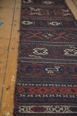 Side view of an antique Belouch soumac runner detailing its intricate flatweave and traditional geometric patterns.