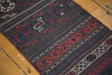 Angled perspective on the intricate flat weave of a Persian Belouch soumac runner.