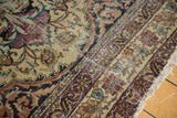 Antique Kermanshah rug border, exhibiting Safavid inspired floral arabesques and tattered fringe.