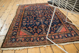 Engelas rug corner with indigo blue, terra cotta Herati motifs and light pile.