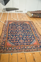 Fringe, low pile, and terra cotta geometric border on a vintage Persian Engelas rug.