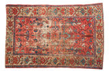 Antique Malayer rug: faded raspberry field, floral medallion, vinery, and central wear.