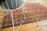 Antique Malayer rug, border detail with rectilinear blush red florals and celadon green vinery.