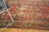 Antique Malayer rug detail: isolated wear with exposed foundation, faded raspberry, blue floral vinery.