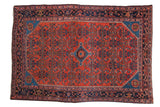 Hand-knotted vintage Persian Engelas rug with brick red field, sapphire blue diamond medallion, allover Herati.
