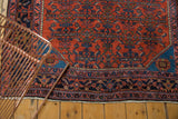 Vintage Engelas rug corner: intricate brick red Herati motif and sapphire blue spandrel.