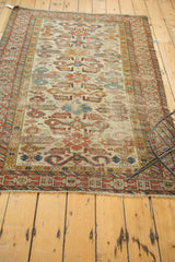 Antique Perpedil rug's geometric Kufic border in madder red and ivory with tattered fringe.