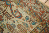 Geometric Kufic border and rams horn motifs in madder root red and sky blue on an antique Perpedil rug.