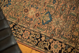 Antique Farahan Sarouk rug: blush field, blue scalloped florals, and a patterned navy border.