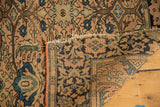 Antique Farahan Sarouk rug's hand-knotted foundation and dusty rose, green floral patterns.